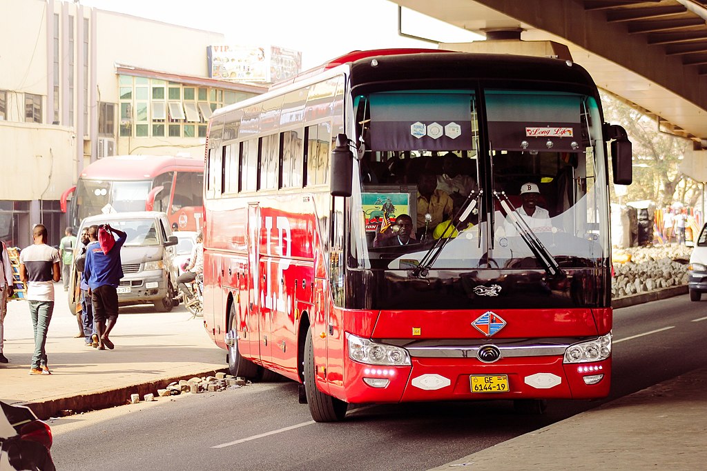 A local red bus coming out of the Circle Bus station at Accra (Wikimedia Commons, Joris Darlington Quarshie, CC-BY-4.0)