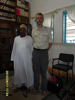 Mahmood Nurudin Hussein, spiritual leader of the Shadhiliyya brotherhood in his library