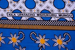 Fragment of kanga with Swahili text “Kila upatacho mshukuru mungu” (Thank God for everything you get).