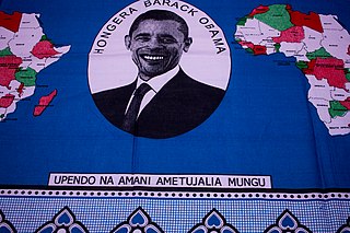 Fragment of kanga from Tanzania. With Swahili texts: “Upendo na amani ametujalia Mungu” and “Hongera Barack Obama” (Love and peace have been granted us by God, and Congratulations Barack Obama).